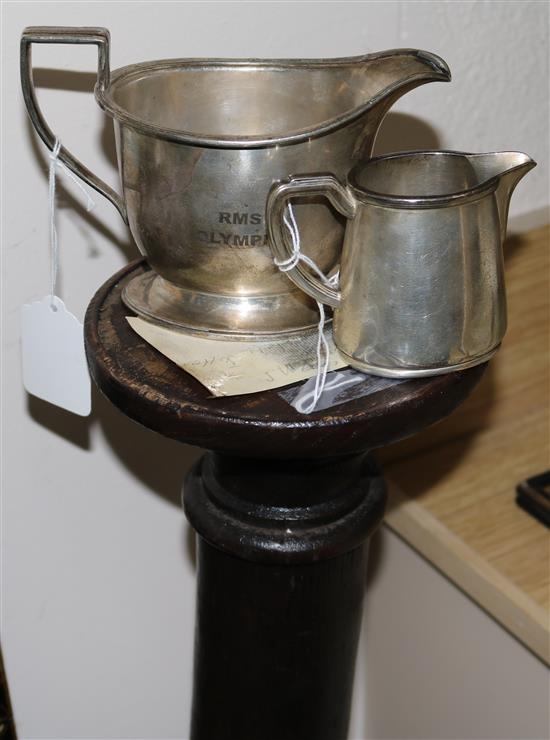 A Cunard White Star Line plated cream jug and sauceboat and an oak pillar with etched RMS Olympic flag